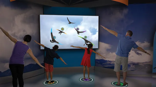 This artist rendering provided by the designers, Evergreen Exhibitions, shows “Spread Your Wings”, part of new high-tech interactive exhibition, “Above and Beyond: The Ultimate Interactive Flight Exhibition”, about the future of flight opening soon at the Smithsonian's National Air and Space Museum in Washington that could serve as an important test case for new technologies to overhaul the museum. (Photo by Evergreen Exhibitions via AP Photo)
