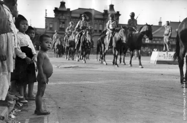 South Korean Cavalry troops forming up in a street in Taegu, before being transported to the front, 1950