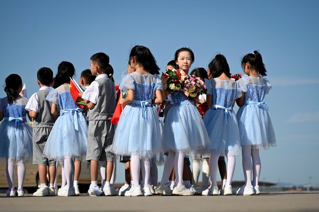 Chinese Children prepare to welcome the arrival of Zimbabwe’s President Emmerson Mnangagwa at Beijing Capital Airport ahead of the Forum on China-Africa Cooperation (FOCAC) in Beijing, China, 02 September 2024. The FOCAC will be held from 04 to 06 September 2024. (Photo by Wang Zhao/EPA/EFE)