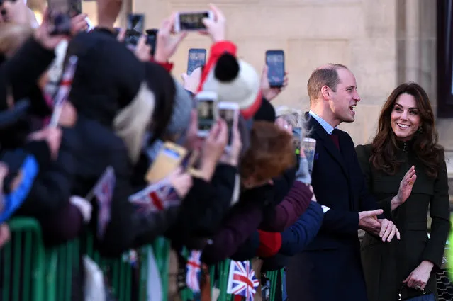 Britain's Prince William, Duke of Cambridge (L) and Britain's Catherine, Duchess of Cambridge arrive for a visit to City Hall in Centenary Square, Bradford on January 15, 2020, to meet young people and hear about their life in Bradford. (Photo by Oli Scarff/AFP Photo)