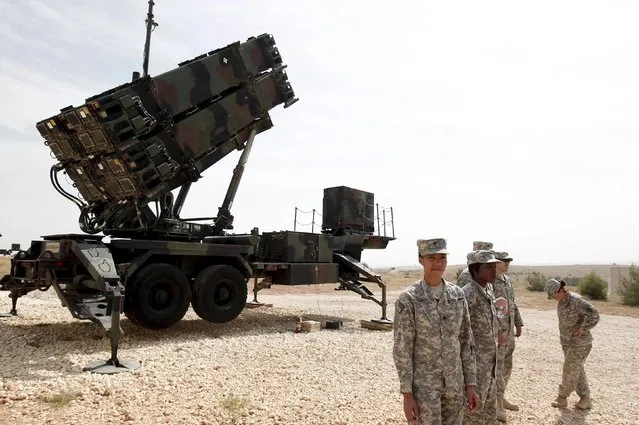 U.S. soldiers stand beside a U.S. Patriot missile system at a Turkish military base in Gaziantep, southeastern Turkey, in this October 10, 2014 file photo. The United States and Germany said they will pull Patriot missile batteries from southern Turkey after a reassessment of the threats stemming from the conflict in neighbouring Syria. The U.S. Patriots, in Turkey as part of a broader NATO mission since 2013, will be redeployed to the United States for upgrades, according to a joint Turkish-U.S. statement on Sunday. (Photo by Osman Orsal/Reuters)