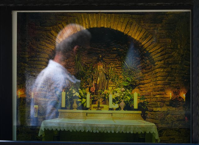 Mgr Eric de Moulins-Beaufort, Archbishop of Reims, France and President of the French Council of Bishops lead the mass held in the House of the Virgin Mary as the part of Assumption of the Blessed Virgin Mary in Selcuk district of Izmir, Turkiye on August 15, 2024. Christians lit candles and prayed "Praise to the Virgin Mary" during and after the service, and hung the wishes they had written on napkins and papers at the wish-making place. (Photo by Mehmet Emin Menguarslan/Anadolu via Getty Images)