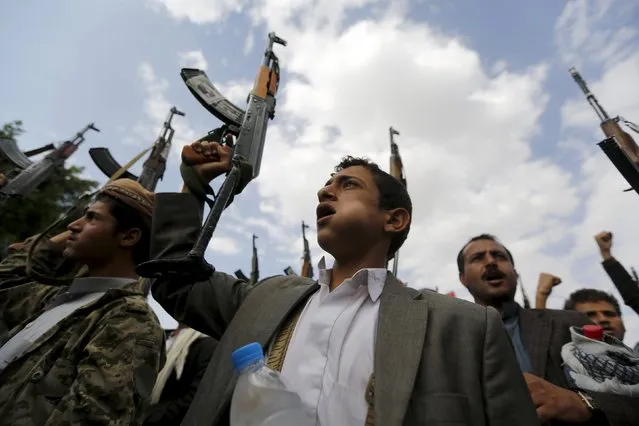 Houthi followers hold up their rifles as they demonstrate against the Saudi-led air strikes in Yemen's capital Sanaa August 24, 2015. (Photo by Khaled Abdullah/Reuters)