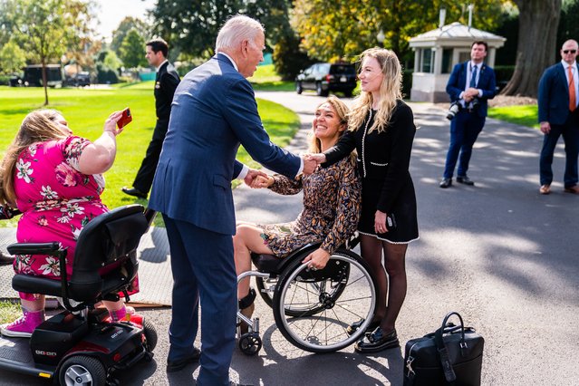 US President Joe Biden greets guest following remarks during a celebration of the Americans with Disabilities Act (ADA) and Rehabilitation Act (Rehab Act) event on the South Lawn of the White House on Monday, October 2, 2023. (Photo by Demetrius Freeman/The Washington Post)