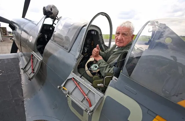 General Emil Bocek, a 93 year old Czech who flew Spitfires in WWII, gives a thumbs up after flying in the back of a twin cockpit Spitfire at Biggin Hill Airport, London, Thursday, July 21, 2016. General Emil Bocek, 93, one of the last surviving Czech Czech airmen to serve in the RAF during WWII, said it was his “dream” to take the controls of a twin-seater Supermarine Spitfire one last time. He was granted his wish at Biggin Hill Airport in Kent where his 20-minute flight revived memories of his time flying the machines during wartime. (Photo by Philip Toscano/PA Wire via AP Photo)
