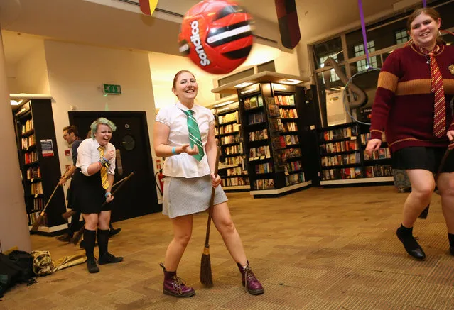 Fans play the fictional game of Qudditch at an event to mark the release of the book of the play of Harry Potter and the Cursed Child parts One and Two at a bookstore in London, Britain July 30, 2016. (Photo by Neil Hall/Reuters)
