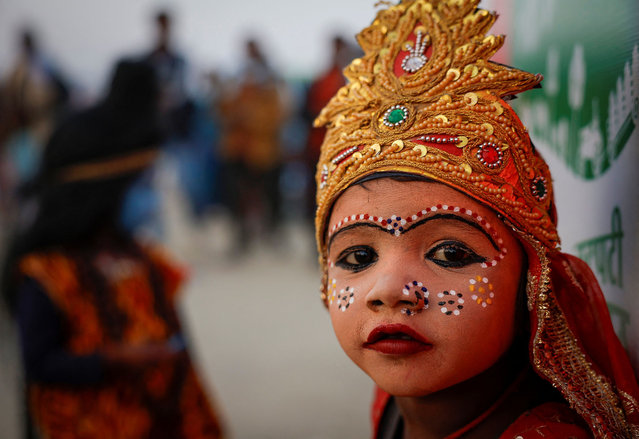 A Hindu girl dressed as “Goddess” looks on during the “Maha Kumbh Mela”, or the Great Pitcher Festival, in Prayagraj, India, on January 27, 2025. (Photo by Sharafat Ali/Reuters)