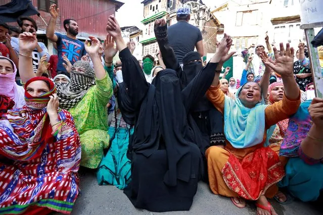 Women attend a demonstration in Srinagar against the killing of English lecturer, Shabir Ahmad, whom they say was killed by members of the security forces following weeks of violence in Kashmir August 18, 2016. (Photo by Cathal McNaughton/Reuters)