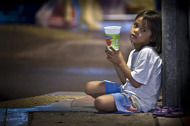 In this November 8, 2008, file photo, a young Thai beggar waits for donations near a popular tourist area in downtown Bangkok, Thailand. Thailand’s stagnating economy is unlikely to get much of a boost from a referendum Sunday on a new constitution proposed by the military government, which took power in a 2014 coup. A “yes” vote could, however, tamp down some of the uncertainty that has plagued the country over the past half-decade of instability. (Photo by David Longstreath/AP Photo)