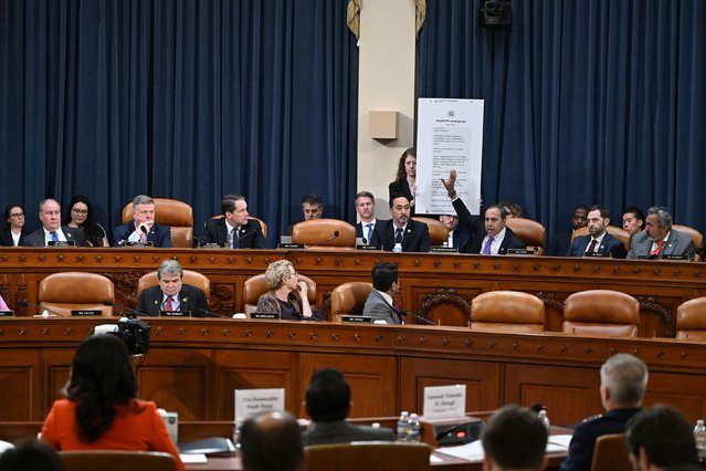 US Rep. Raja Krishnamoorthi points to a screenshot of a Signal group chat during a hearing of the House Select Committee on Intelligence on Wednesday, March 26, 2025.(Photo by Kenny Holston/The New York Times/Redux)