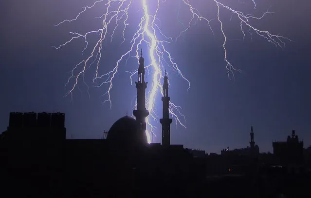 Lightning lights up the sky during a storm in Rafah, Gaza on January 16, 2020. (Photo by Ismael Mohamad/UPI/Barcroft Media)