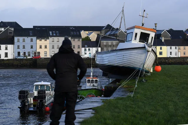 A boat is stranded on the edge of a pier after it was washed there by floods in Galway, Ireland, January 3, 2018. (Photo by Clodagh Kilcoyne/Reuters)
