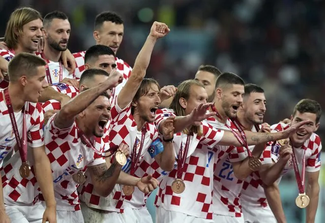 Croatia players celebrate at the end of the World Cup third-place playoff soccer match between Croatia and Morocco at Khalifa International Stadium in Doha, Qatar, Saturday, December 17, 2022. (Photo by Frank Augstein/AP Photo)