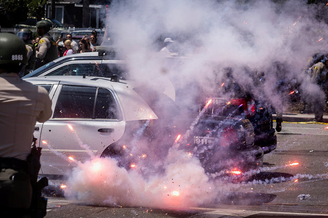 A firework explodes after being thrown at police during a standoff with protesters following multiple detentions by Immigration and Customs Enforcement (ICE), in the Los Angeles County city of Paramount, California, U.S., June 7, 2025. (Photo by Barbara Davidson/Reuters)
