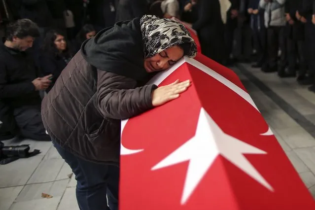 Relatives and friends of Arzu Ozsoy and her 15-year-old daughter Yagmur Ucar, who died in Sunday's explosion occurred on Istiklal avenue, attend their funeral in Istanbul, Turkey, Monday, November 14, 2022. Turkish police said Monday that they have detained a Syrian woman with suspected links to Kurdish militants and that she confessed to planting a bomb that exploded on a bustling pedestrian avenue in Istanbul, killing six people and wounding several dozen others. (Photo by Emrah Gurel/AP Photo)