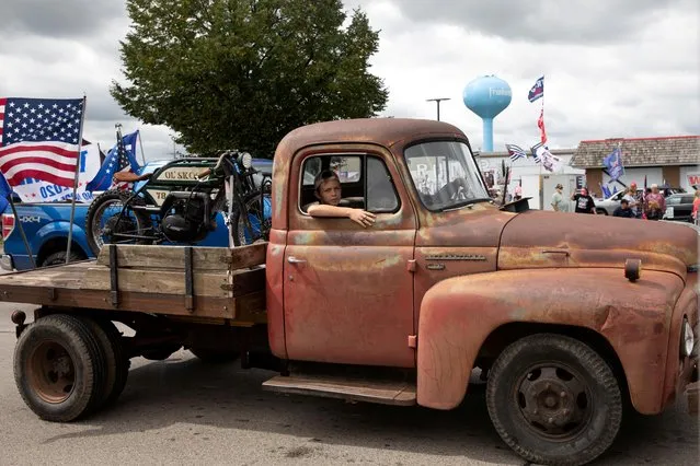 People take part in a classic car cruise in support of U.S. President Donald Trump and law enforcement in Frankenmuth, Michigan, U.S., September 13, 2020. (Photo by Emily Elconin/Reuters)