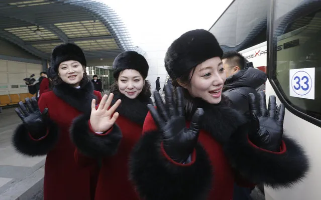 North Korean cheering squads wave upon their arrival at the Korean-transit office near the Demilitarized Zone in Paju, South Korea, Wednesday, February 7, 2018. (Photo by Ahn Young-joon/AP Photo)