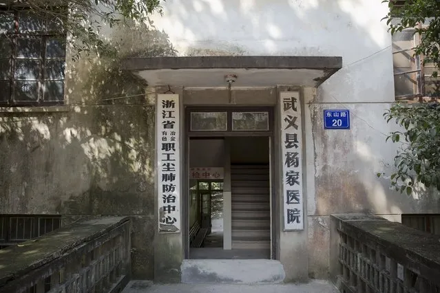 The entrance to Yangjia Hospital is seen in Wuyi County, Zhejiang Province, China October 19, 2015. At Yangjia Hospital in a remote corner of China's eastern Zhejiang province, sufferers of dust lung spend much of their time hooked up to oxygen to treat lungs ravaged by work in a local mine, since shut down. (Photo by Damir Sagolj/Reuters)