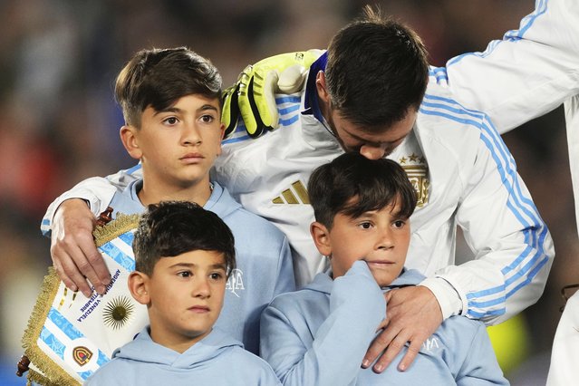 Argentina' Lionel Messi embraces his sons prior to a World Cup 2026 qualifying soccer match against Venezuela at the Monumental stadium in Buenos Aires, Argentina, Thursday, September 4, 2025. (Photo by Gustavo Garello/AP Photo)
