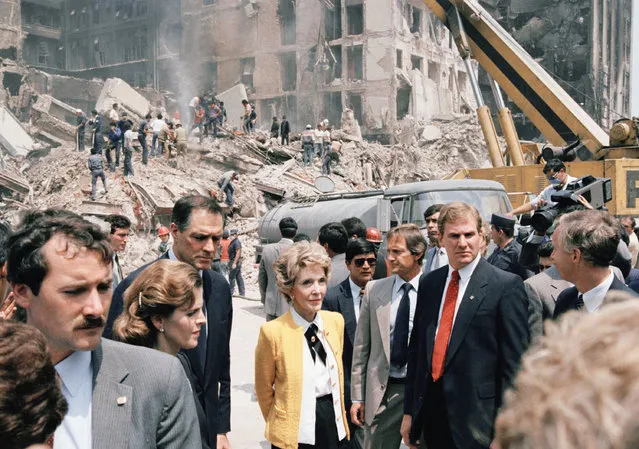 First Lady Nancy Reagan views earthquake damage tour of Mexico City Monday, September 23, 1985. While in Mexico City, Mrs. Reagan delivered a letter of sympathy from her husband and a $1 million “down payment” on U.S. government disaster aid to Mexico.   At left is Ambassador John Gavin and Mrs. Miguel del la Madrid, wife of Mexico's president. (Photo by Bob Dougherty/AP Photo)
