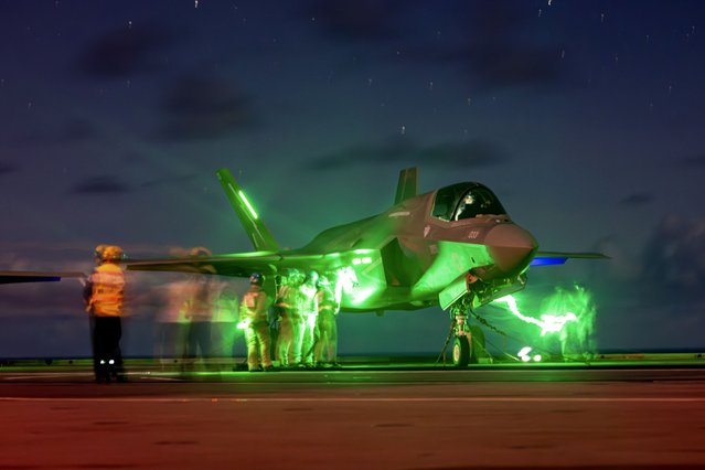 An F-35B Lightning II is prepared for night flying operations aboard HMS Prince of Wales during the multinational Operation Highmast in the Indo-Pacific in the first decade of August 2025. (Photo by Royal Navy)