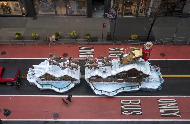 The Santa Claus float that is part of the modified Macy's Thanksgiving Day Parade is seen from the Empire State Building in New York, Thursday, November 26, 2020. Due to the pandemic, no crowds of onlookers were allowed to attend the annual parade. (Photo by Craig Ruttle/AP Photo)