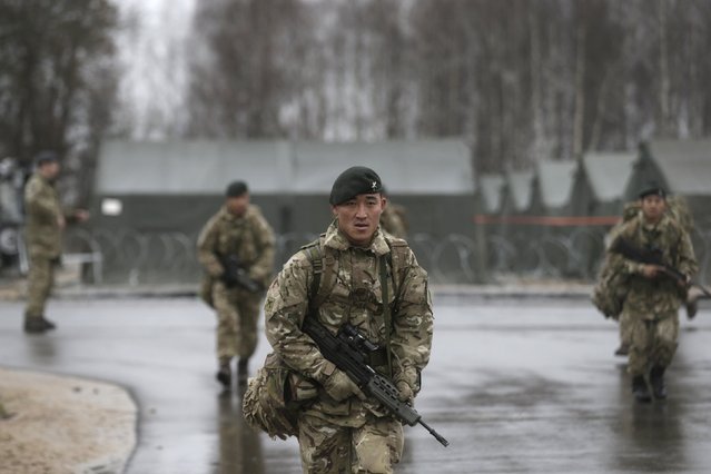 British army gurkhas of UK-based NATO Allied Rapid Reaction Corps (ARRC) attend military exercise Arrcade Fusion 2015 in Lielvarde, Latvia, November 17, 2015. (Photo by Ints Kalnins/Reuters)