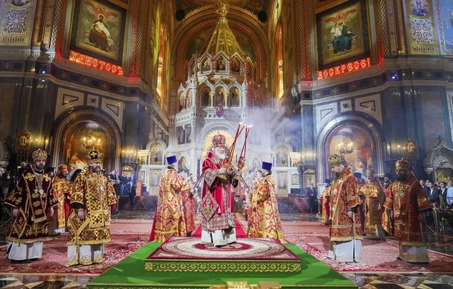 Russian Orthodox Church Patriarch Kirill, center, conducts an Orthodox Easter service in the Christ the Savior Cathedral, in Moscow, Russia, Sunday, April 16, 2023. (Photo by Oleg Varov, Russian Orthodox Church Press Service via AP Photo)