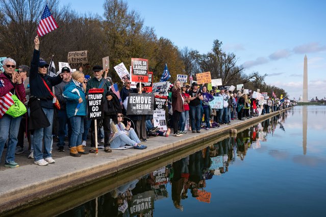 People line the reflecting pool to protest during the 'Remove the Regime' rally at the Lincoln Memorial in Washington, DC, USA, 22 November 2025. The rally speakers are calling for US President Trump's impeachment and removal. (Photo by Luke Johnson/EPA)
