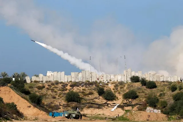A rocket is launched by Palestinian militant groups into the Mediterranean Sea off the Gaza Strip at the start of their first-ever joint exercise, in Gaza City on December 29, 2020. (Photo by Mohammed Salem/Reuters)