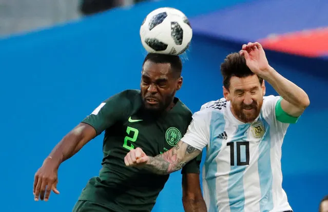 Brian Idowu of Nigeria (left) and Argentina's Lionel Messi fight for the ball during the group D match between Argentina and Nigeria, during the 2018 soccer World Cup at the St. Petersburg Stadium on June 26, 2018. (Photo by Jorge Silva/Reuters)