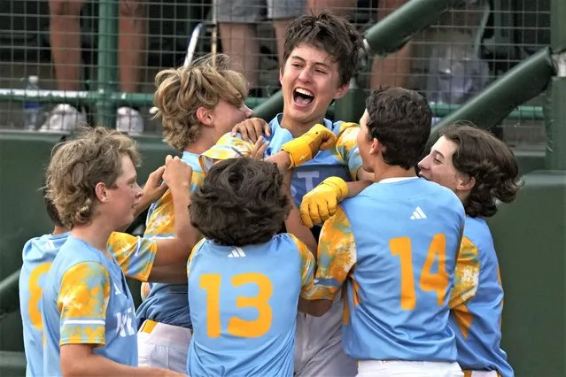 El Segundo, Calif.'s Louis Lappe, center, celebrates with teammates after hitting a solo walk-off home run off Curacao's Jay-Dlynn Wiel during the sixth inning of the Little League World Series Championship game in South Williamsport, Pa., Sunday, August 27, 2023. California won 6-5. (Photo by Gene J. Puskar/AP Photo)