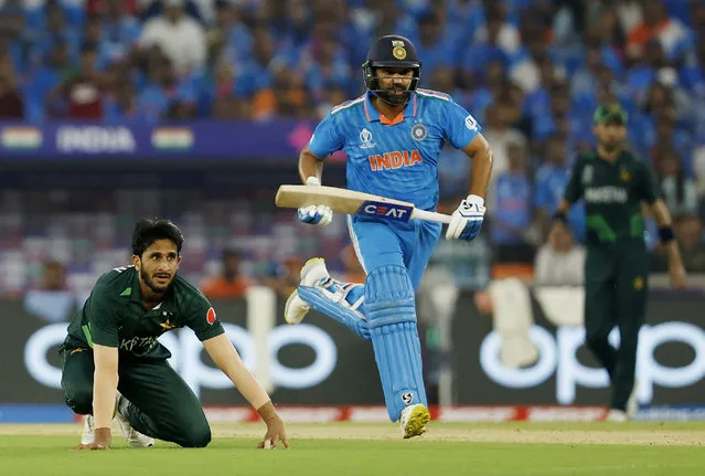 India's Rohit Sharma in action running between the wickets as Pakistan's Hasan Ali looks on at Narendra Modi Stadium in Ahmedabad, India on October 14, 2023. (Photo by Francis Mascarenhas/Reuters)