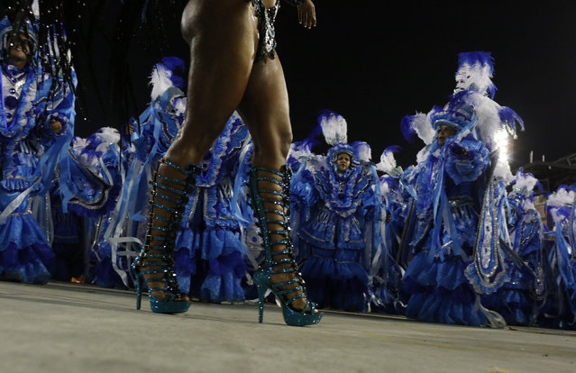 A reveller of the Unidos da Tijuca samba school performs during the carnival parade at the Sambadrome in Rio de Janeiro, Brazil February 8, 2016. (Photo by Pilar Olivares/Reuters)