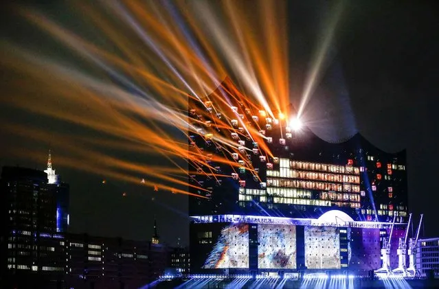 A light show illuminates the building after the opening ceremony of the Elbphilharmonie concert hall in Hamburg, northern Germany, Wednesday, January 11, 2017. (Photo by Markus Scholz/DPA via AP Photo)