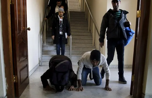 Iraqi refugees returning from Finland kneel down and kiss the ground after arriving at Baghdad airport, Iraq February 18, 2016. Thousands of Iraqi refugees who arrived in Finland last year have decided to cancel their asylum applications and to return home voluntarily, citing family issues and disappointment with life in the frosty Nordic country. (Photo by Khalid al Mousily/Reuters)