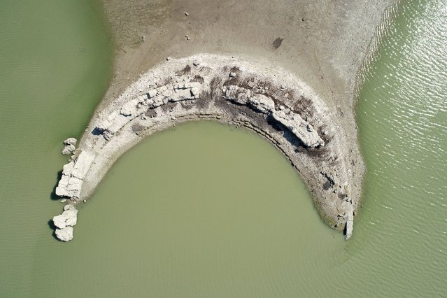 A drone photo shows an aerial view of a part of Augusta Ancient City, belonging to the Roman period, revealed following the withdrawal of water level of Seyhan Dam Lake, in Adana, Turkey on September 07, 2021. (Photo by Eren Bozkurt/Anadolu Agency via Getty Images)