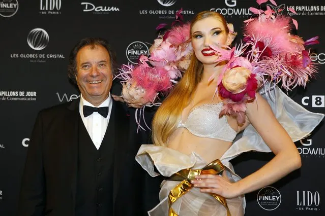 French actor Daniel Russo poses during a photo call at the Lido cabaret on the Champs Elysees, to take part in the Crystal Globes awards ceremony in Paris, Monday, December 30, 2016. (Photo by Francois Mori/AP Photo)