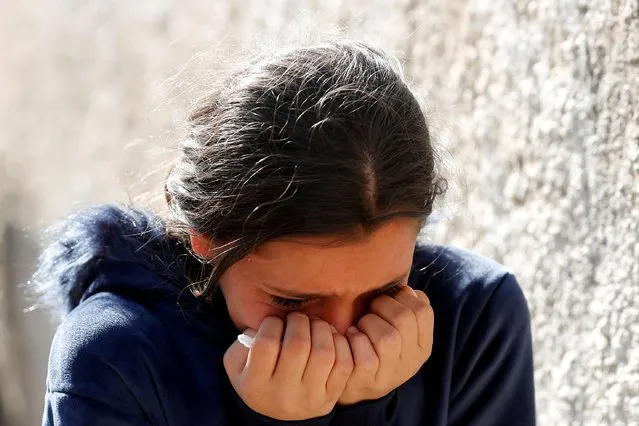 A child mourns during a funeral of an armed Palestinian, who was killed during clashes with Israeli forces, in Tammun, in the Israeli-occupied West Bank on November 16, 2021. (Photo by Mohamad Torokman/Reuters)