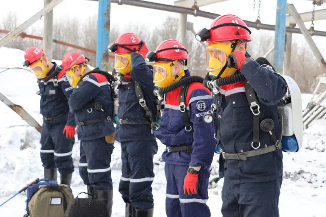 In this Russian Emergency Situations Ministry Thursday, November 25, 2021 photo, rescuers prepare to work at a fire scene at a coal mine near the Siberian city of Kemerovo, about 3,000 kilometres (1,900 miles) east of Moscow, Russia,. Russian authorities say a fire at a coal mine in Siberia has killed nine people and injured 44 others. Dozens of others are still trapped. A Russian news agency says the blaze took place in the Kemerovo region in southwestern Siberia. (Photo by Russian Ministry for Emergency Situations photo via AP Photo)