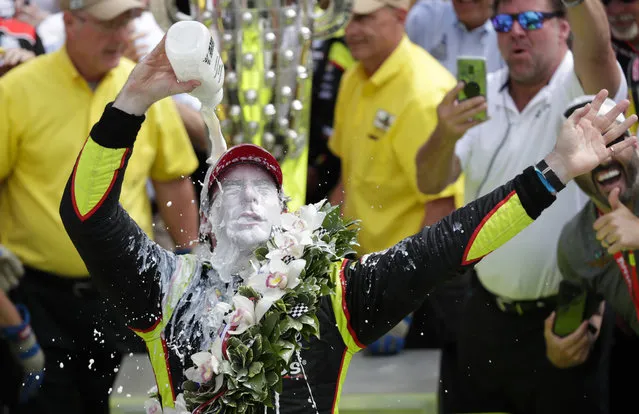 Simon Pagenaud, of France, celebrates after winning the Indianapolis 500 IndyCar auto race at Indianapolis Motor Speedway, Sunday, May 26, 2019, in Indianapolis. (Photo by Michael Conroy/AP Photo)