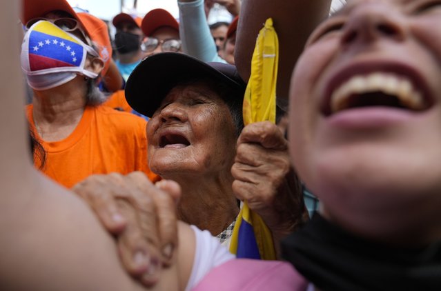 Supporters of opposition leader Freddy Superlano cheer during a demonstration in Barinas, Venezuela, Saturday, December 4, 2021. (Photo by Ariana Cubillos/AP Photo)