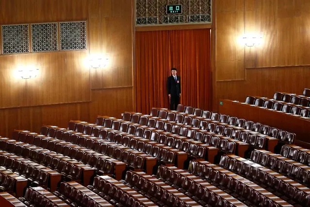 A security officer stands guard ahead of the opening session of the National People's Congress (NPC) at the Great Hall of the People in Beijing, China, March 5, 2017. (Photo by Thomas Peter/Reuters)
