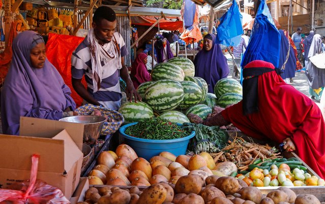 Somali traders sell vegetables at an open-air grocery market as Muslims start the fasting month of Ramadan, the holiest month in the Islamic calendar, in Warta Nabada District of Mogadishu, Somalia on March 11, 2024. (Photo by Feisal Omar/Reuters)