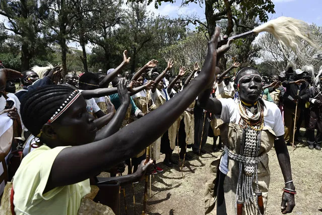 Members of Sengwer community living in Embobut forest, Elgeyo Marakwet (403km from Nairobi) gather to march to the office of the President Uhuru Kenyatta, as they present a petition seeking to stop eviction from the forest they have called their home for centuries, and be recognised as a distinct tribe in Nairobi on October 7, 2019. (Photo by Simon Maina/AFP Photo)