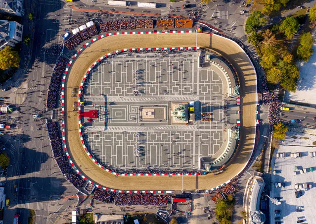A picture taken with a drone shows the temporary race course set up on the perimeter of Heroes Square on the final day of the 12th National Gallop Hussar-themed equestrian festival in Budapest, Hungary, 20 October 2019. (Photo by Balazs Mohai/EPA/EFE)