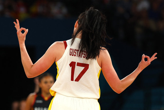 Megan Gustafson of Spain celebrates after scoring a three-point basket during the women’s quarter-final against Belgium at Bercy Arena in Paris, France on August 07, 2024. (Photo by Brian Snyder/Reuters)