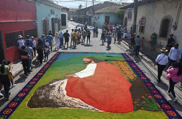 Picture of a sawdust carpet depicting Jesus Christ seen on a street in Comayagua, Honduras, on April 7, 2023, during Holy Week. (Photo by Orlando Sierra/AFP Photo)