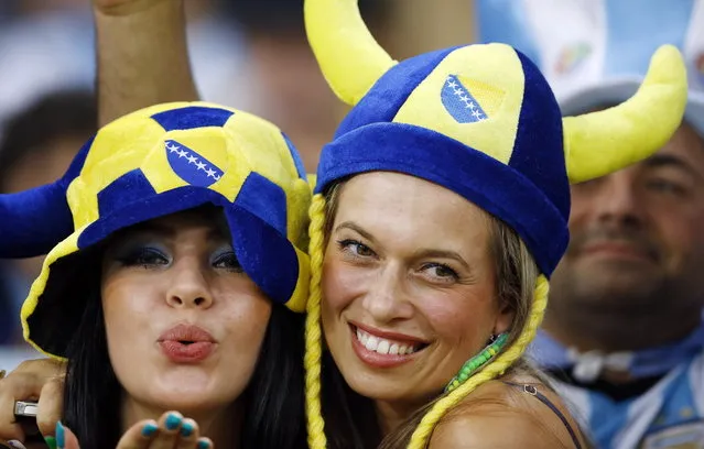 Fans pose before the start of the group F World Cup soccer match between Argentina and Bosnia at the Maracana Stadium in Rio de Janeiro, Brazil, Sunday, June 15, 2014. (Photo by Kirsty Wigglesworth/AP Photo)