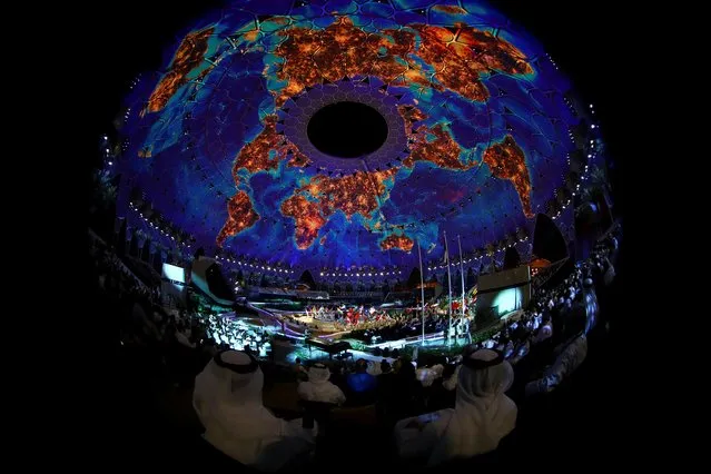 People attend the opening ceremony of the Dubai Expo 2020 in Dubai, United Arab Emirates, September 30, 2021. Picture taken with a fisheye lens. (Photo by Ahmed Jadallah/Reuters)
